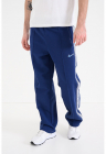 Pantaloni de trening cu banda logo si buzunare cu fermoar – Bleumarin – FashionDays.ro
